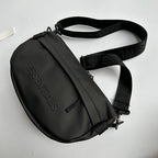 Essentials Embossed Letter Cross Bag